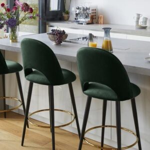 Bar chair with green cushion, black metal finish and gold footrest ring